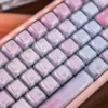 Ethereal Celestial Pink Gradient Keycaps set, showcasing their dreamy dye-sub PBT design and backlit legends from various angles.
