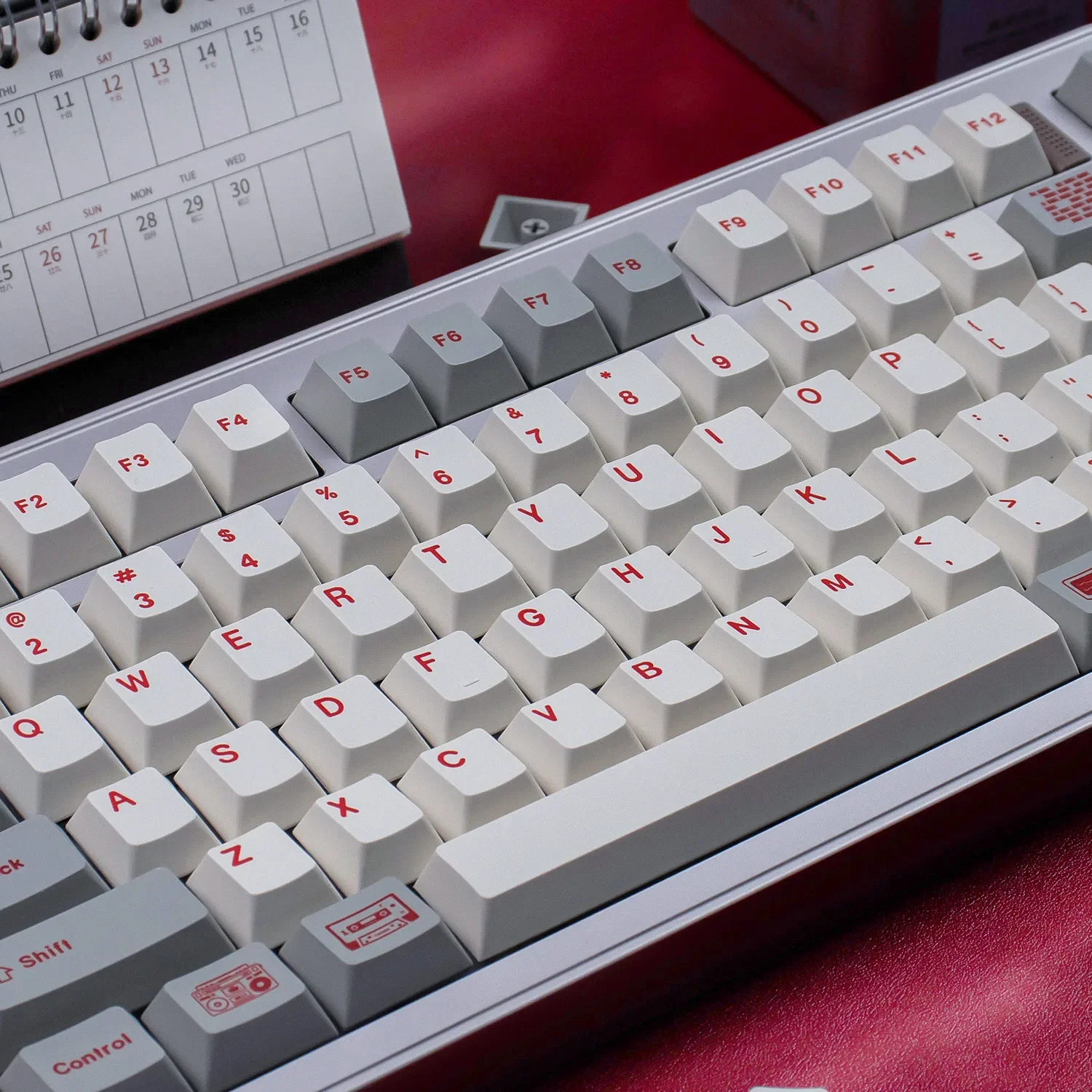 Retro Flooding Keycap Set. This gallery view highlights the red and cool white legends, showcasing their artistic design.