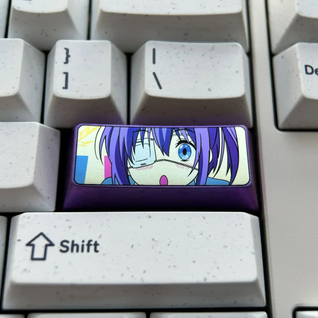 Premium Rikka Takanashi anime custom titanium keycap displaying a vibrant metallic sheen and intricate character details, highlighting its durable design.
