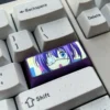 Gallery showcasing the premium titanium Rikka Takanashi anime keycap from various angles, emphasizing its vibrant metallic sheen.
