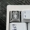 Detailed views of the premium Sakurajima Mai engraved titanium keycap, showcasing its intricate anime art and lustrous metallic finish.