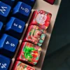 Views of the handcrafted Christmas resin keycap, highlighting its whimsical Santa Claus figure encased in vibrant clear resin. Perfect unique festive design.
