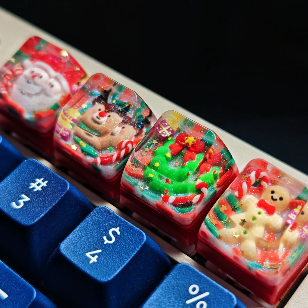 Gallery of the handcrafted Christmas resin keycap, highlighting its whimsical festive design and vibrant details from multiple angles, a unique artisan keycap.