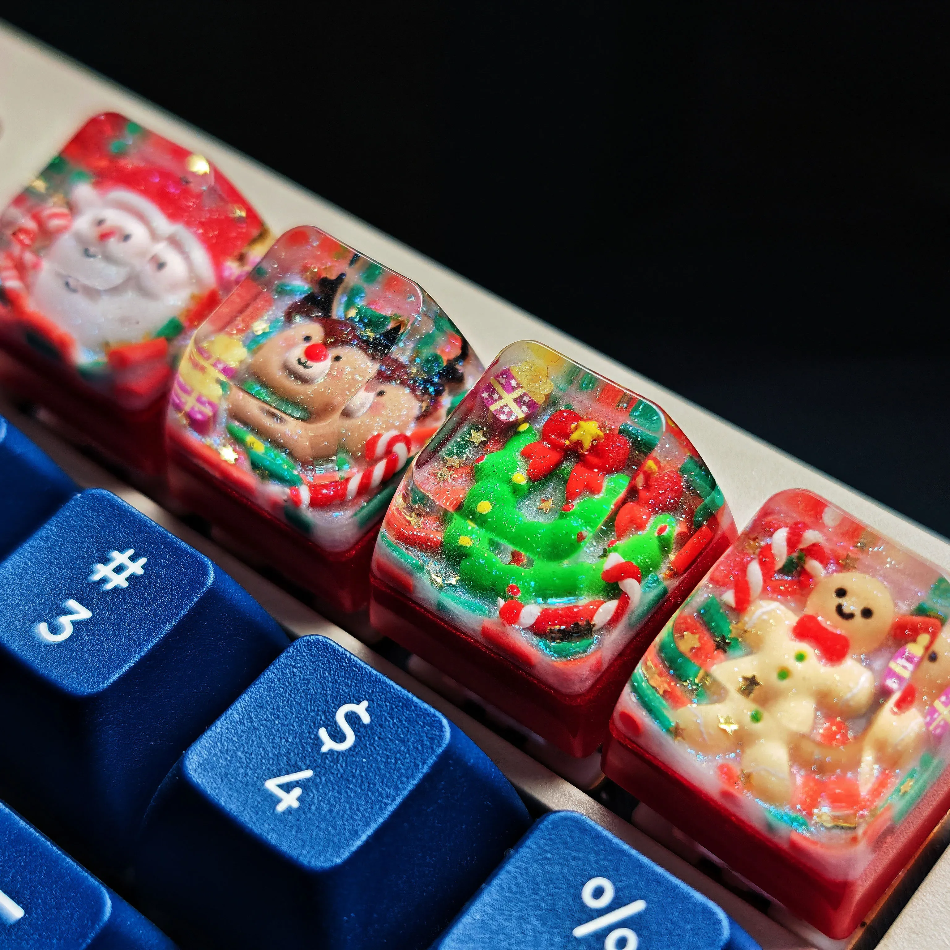 Gallery of the handcrafted Christmas resin keycap, highlighting its whimsical festive design and vibrant details from multiple angles, a unique artisan keycap.