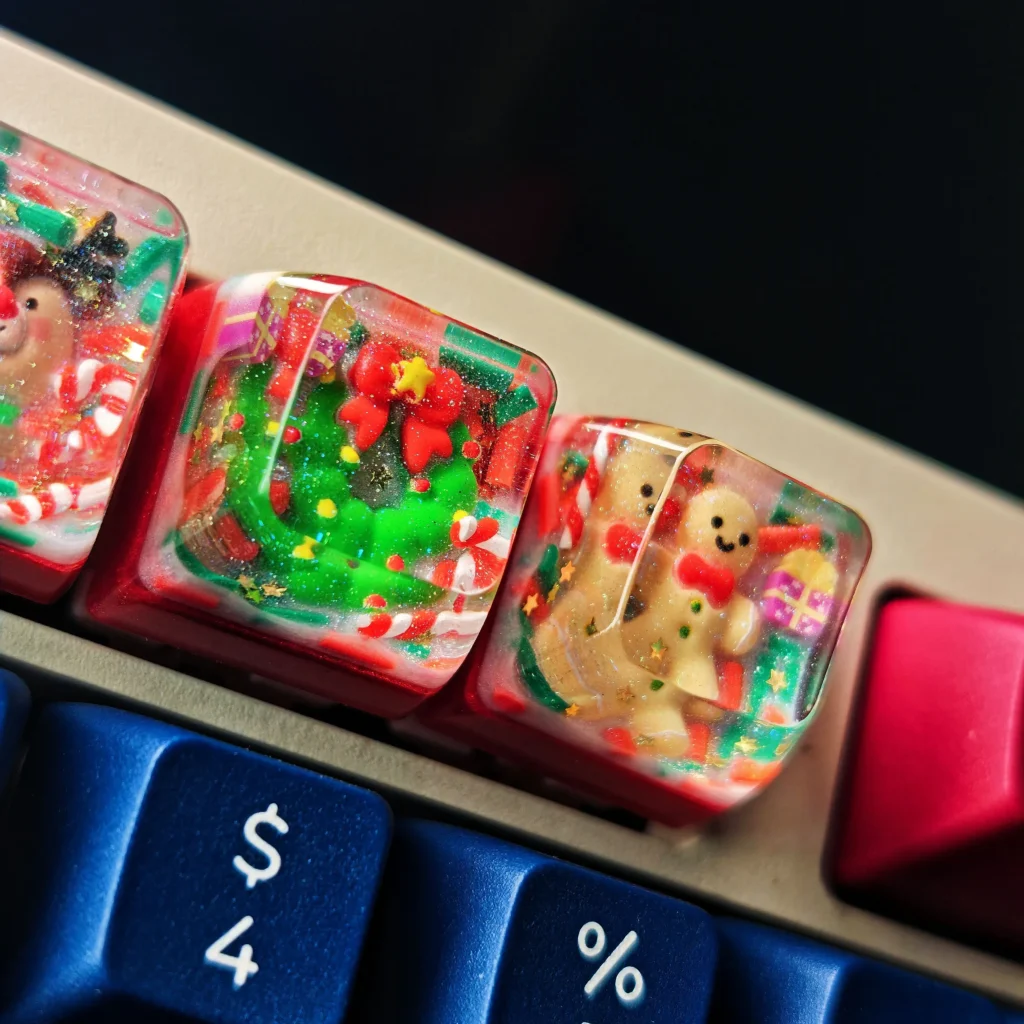 Gallery of the handcrafted Christmas resin keycap, highlighting the whimsical Santa figure perfectly cast in vibrant, clear resin. A unique festive gift.