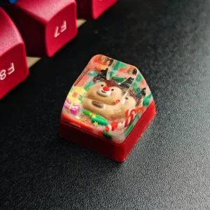 A charming handcrafted Christmas resin keycap, showcasing a whimsical Santa in clear, vibrant resin. A unique festive Christmas artisan keyboard gift.