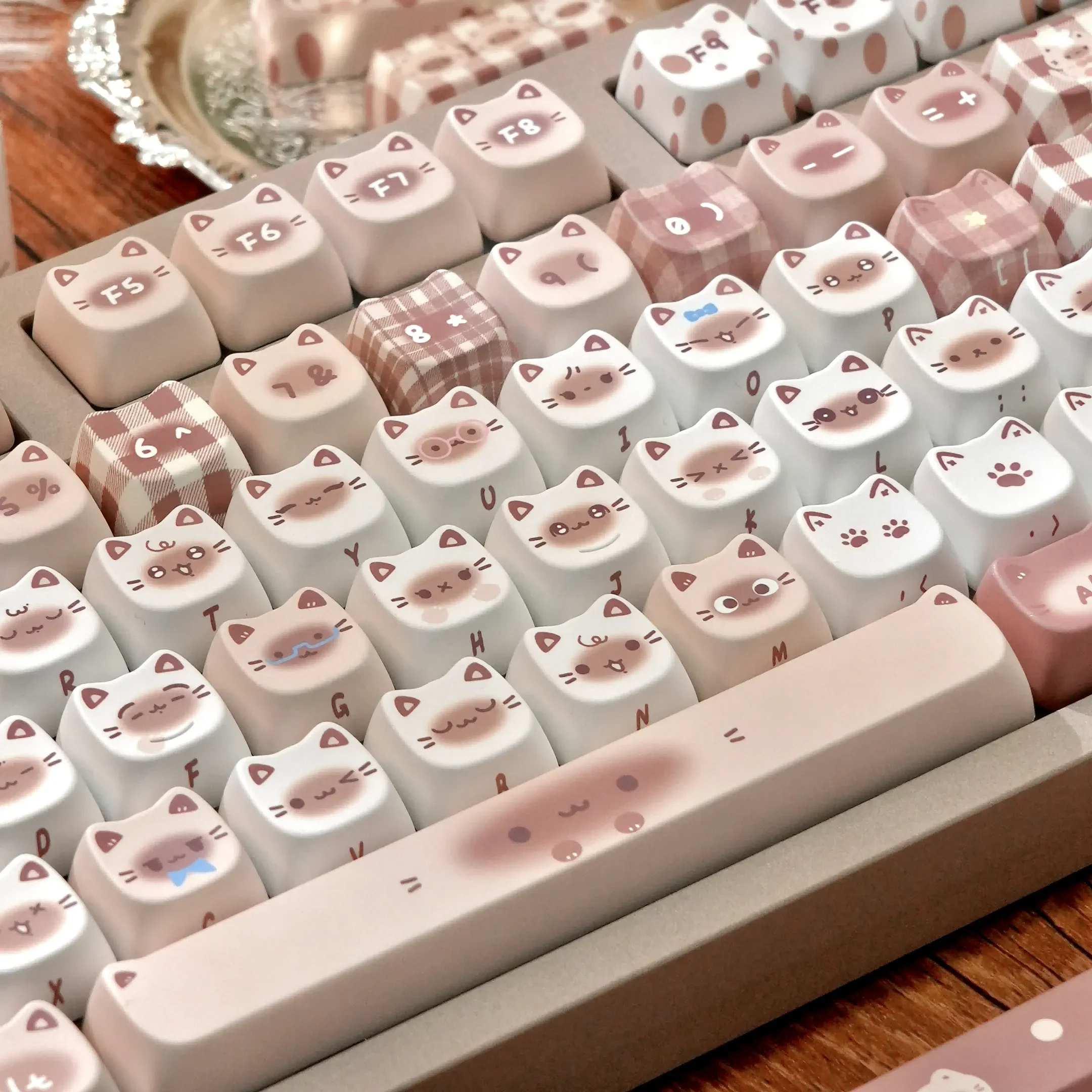 Gallery of exquisite Siamese cat keycaps set, displaying elegant feline motifs in warm coffee tones, crafted from durable dye-sublimated PBT.