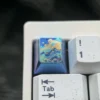 Detailed gallery showcasing the handcrafted titanium artisan keycap, highlighting its serene abstract mountain design and vibrant metallic colors.