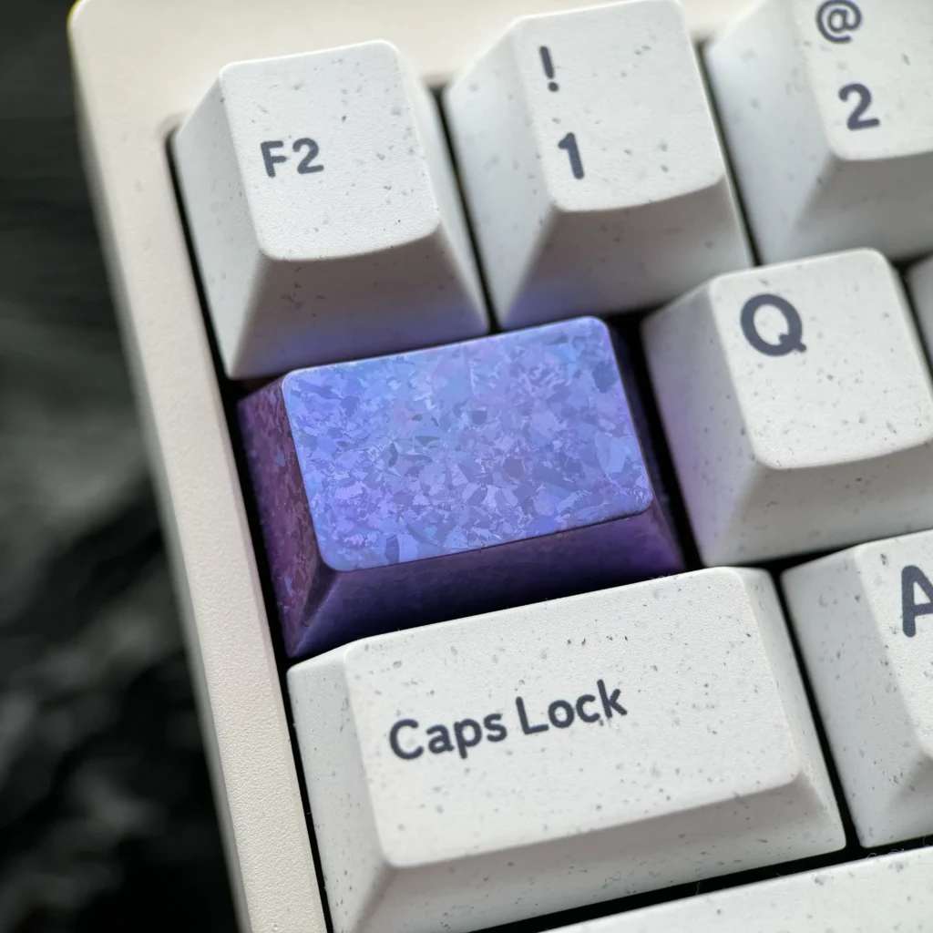 Ice Crystal Titanium Keycap, crafted from premium titanium alloy, showcasing its shimmering, jewel-like facets for custom mechanical keyboards.