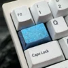 Ice Crystal Titanium Keycap, a premium custom mechanical keycap showcasing its shimmering, jewel-like design and titanium alloy craftsmanship.