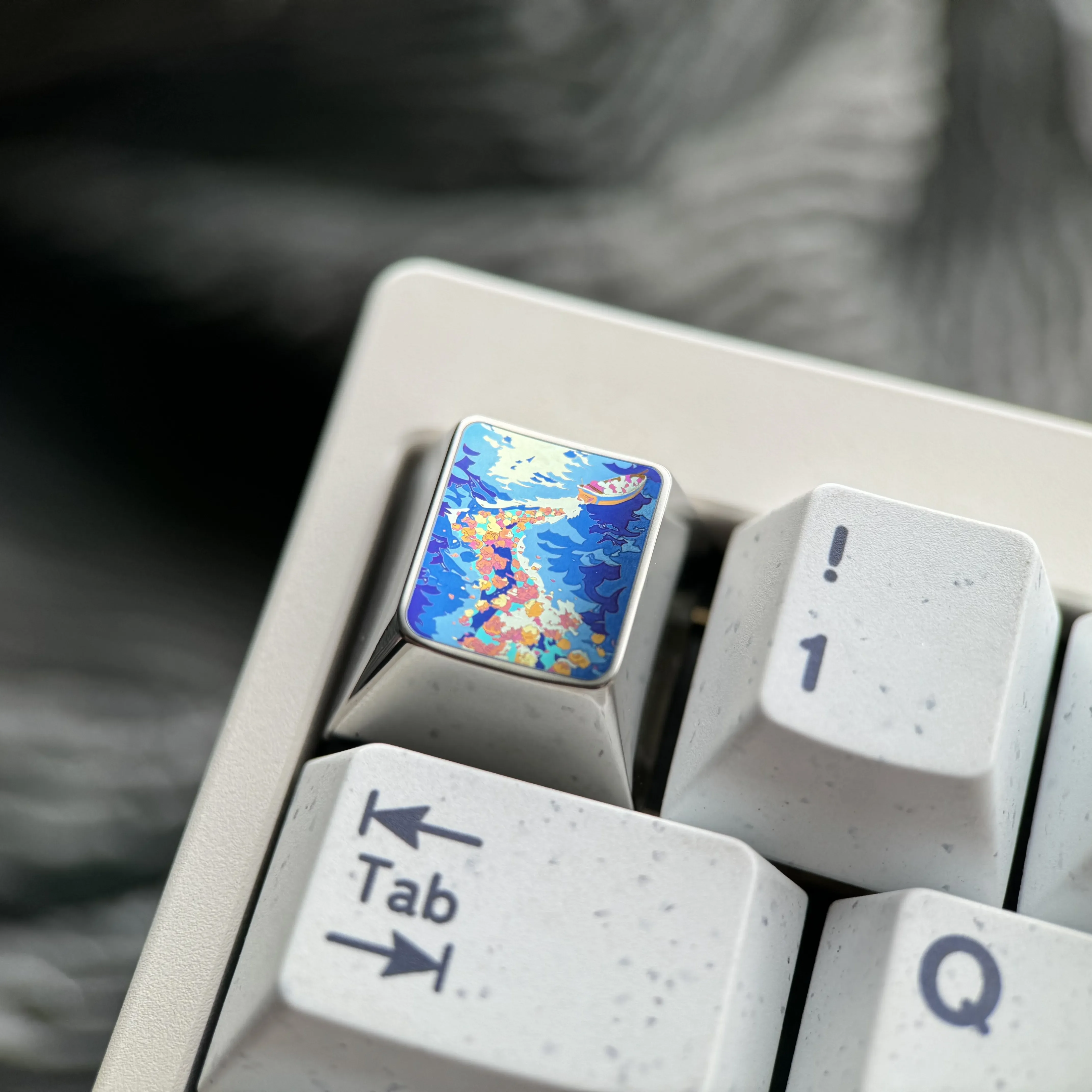 A stunning Vibrant Anime Titanium Wave Keycap featuring a dynamic sculpted ocean wave and reflective premium metallic finish.