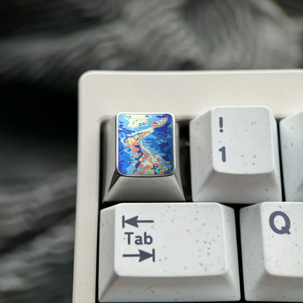 Vibrant Anime Titanium Wave Keycap from multiple angles, showcasing the premium metallic finish and dynamic ocean wave design.