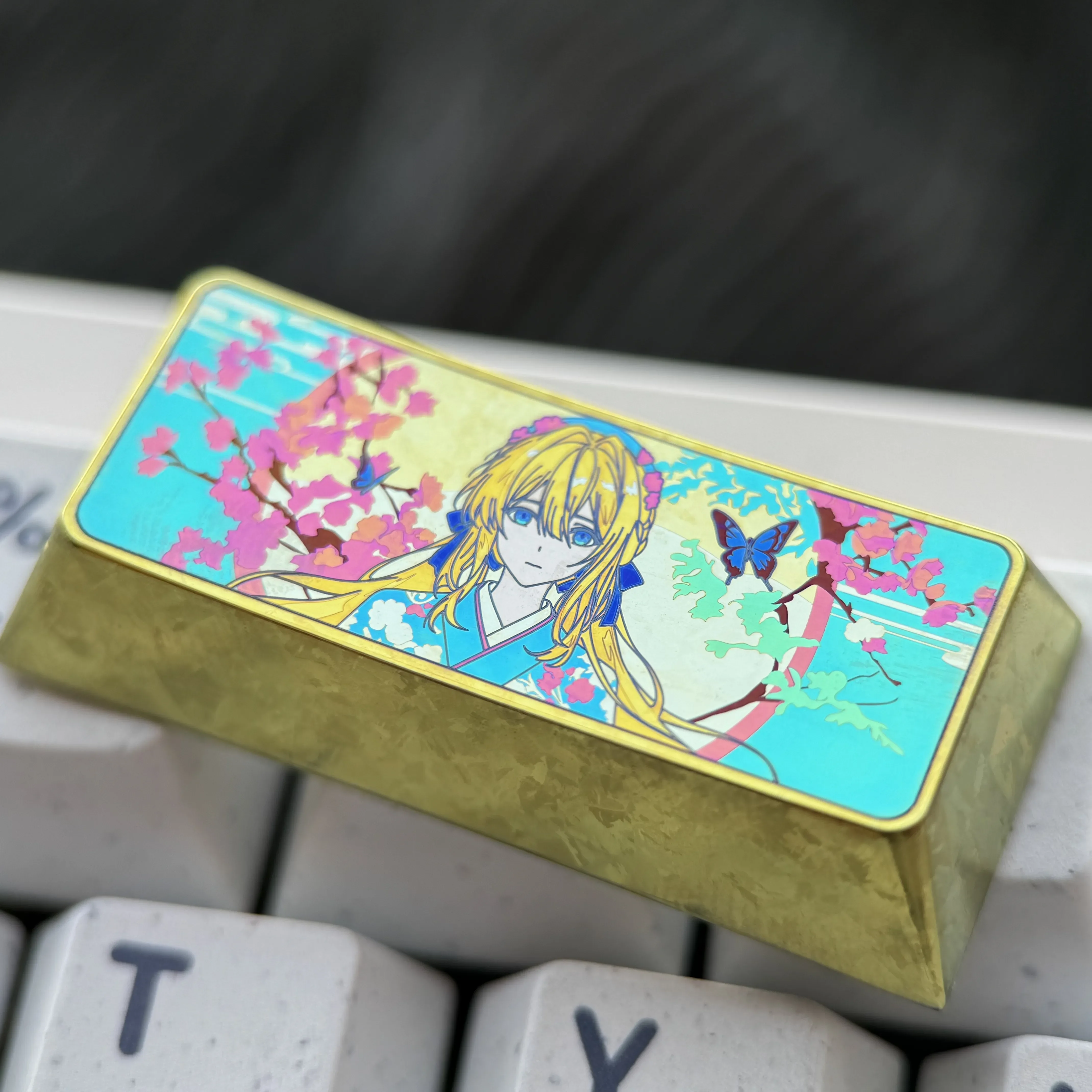 A gallery of handcrafted Violet Evergarden titanium alloy keycaps, meticulously shown from various angles to reveal vibrant anime motifs.