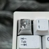 Main image of an exquisite hand-carved titanium Violet Evergarden keycap, highlighting intricate anime art and a lustrous, premium finish.