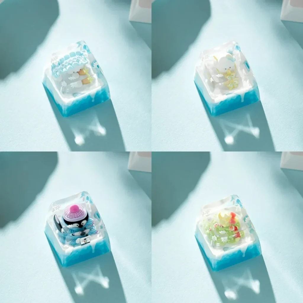 Whimsical handcrafted resin diorama Ice World keycap featuring a cute cartoon penguin playing in a miniature ice world scene.