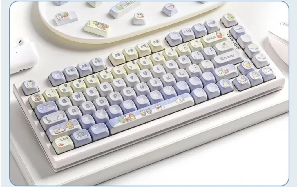 Artistic gallery of the distinct winter-themed PBT dye-sub MOA keycap set, showcasing serene snow-inspired winter keycaps from various cozy angles.