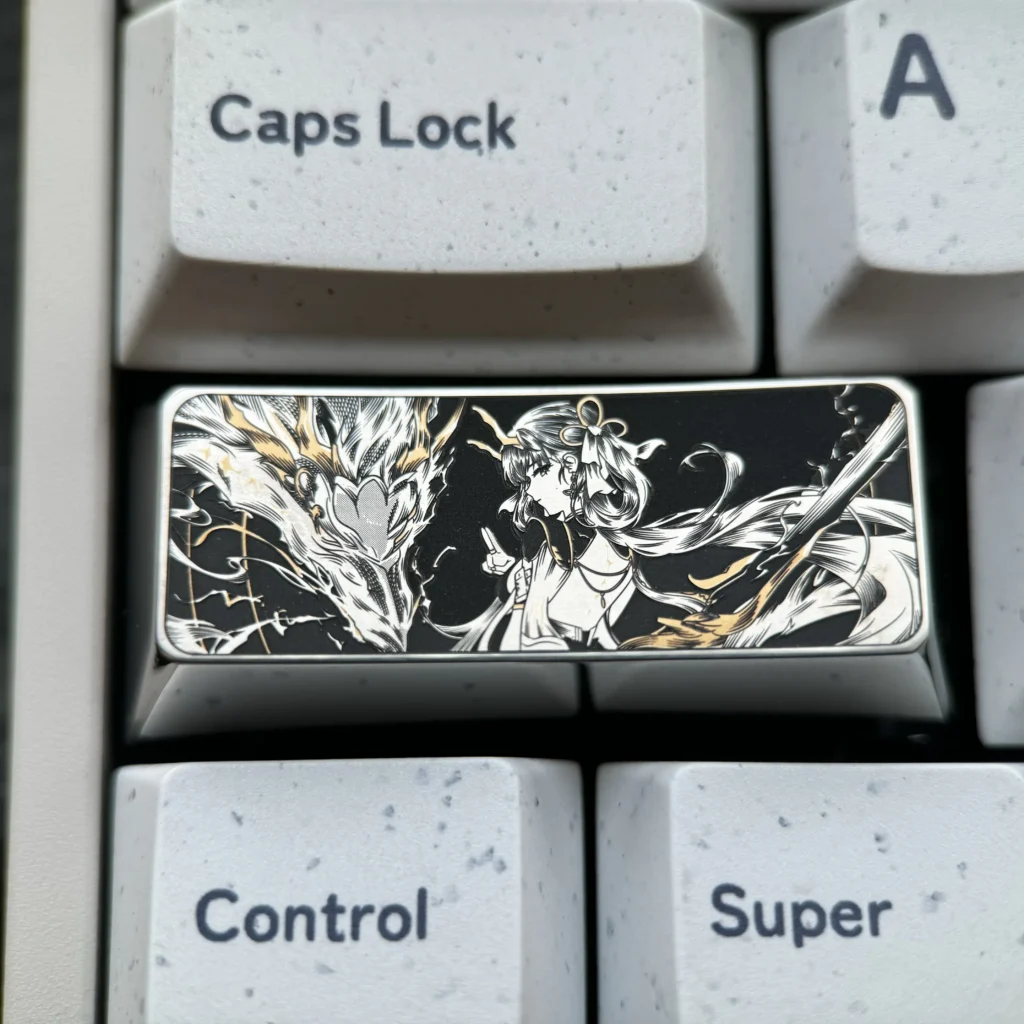 Close-up of a precision-engraved titanium keycap, showcasing intricate vibrant designs and lustrous finish, elevating keyboard artistry.