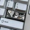 A premium precision-engraved titanium keycap, vividly displaying intricate artwork. Elevate keyboard artistry with this unique piece.