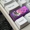Vibrant Yae Miko titanium artisan keycap displaying intricate Genshin Impact anime aesthetics and premium metal craftsmanship.