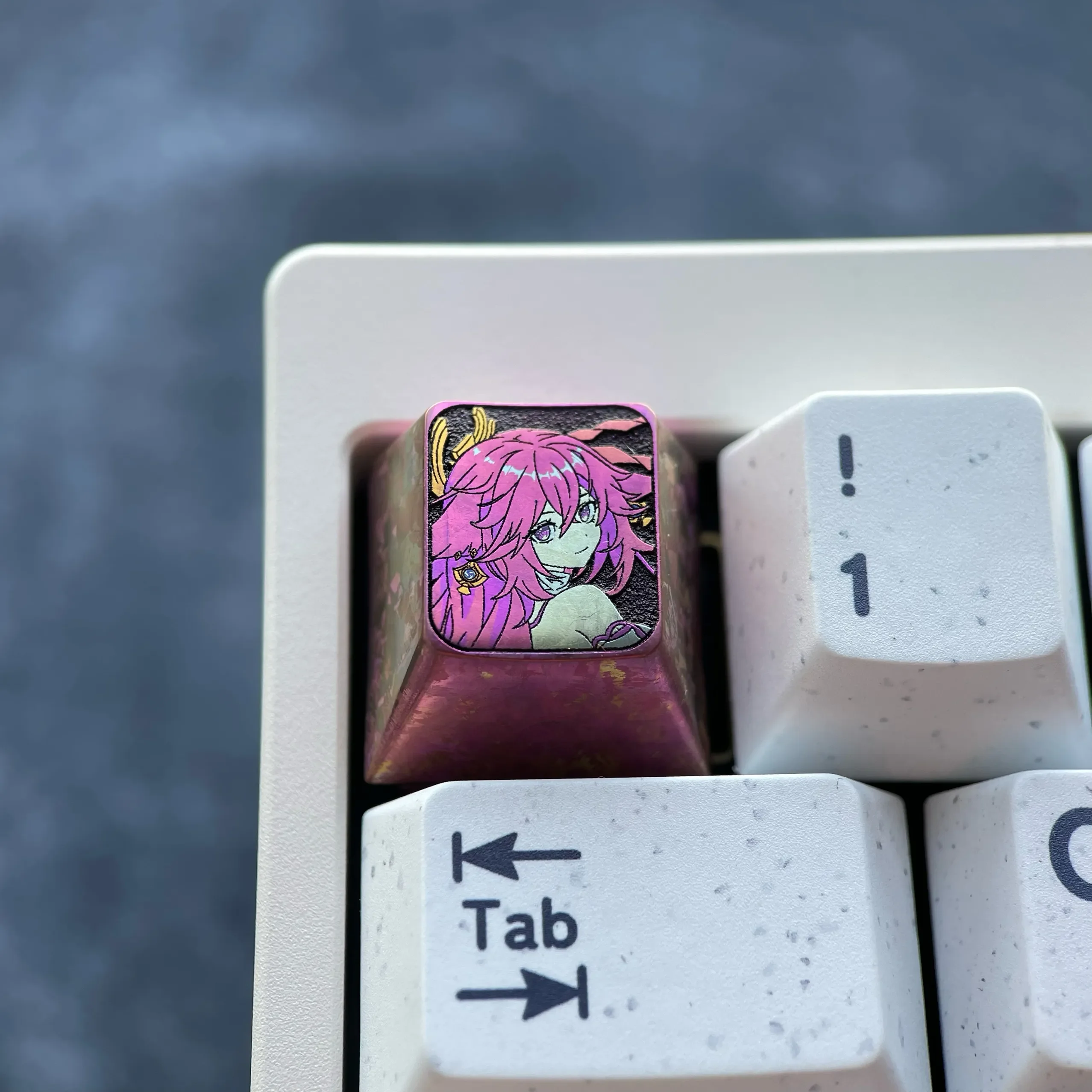 Exquisite anodized titanium Yae Miko keycap showcasing its mystical red hue with crystalline shimmer, embodying divine elegance for custom purpose.