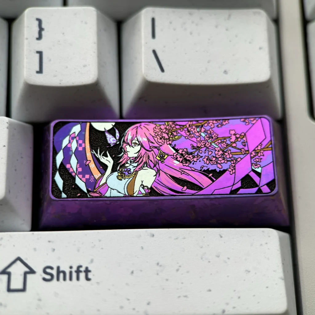 Exquisite Yae Miko Titanium Artisan Keycap, showcasing vibrant Genshin Impact anime aesthetics and intricate details crafted from lustrous metal.