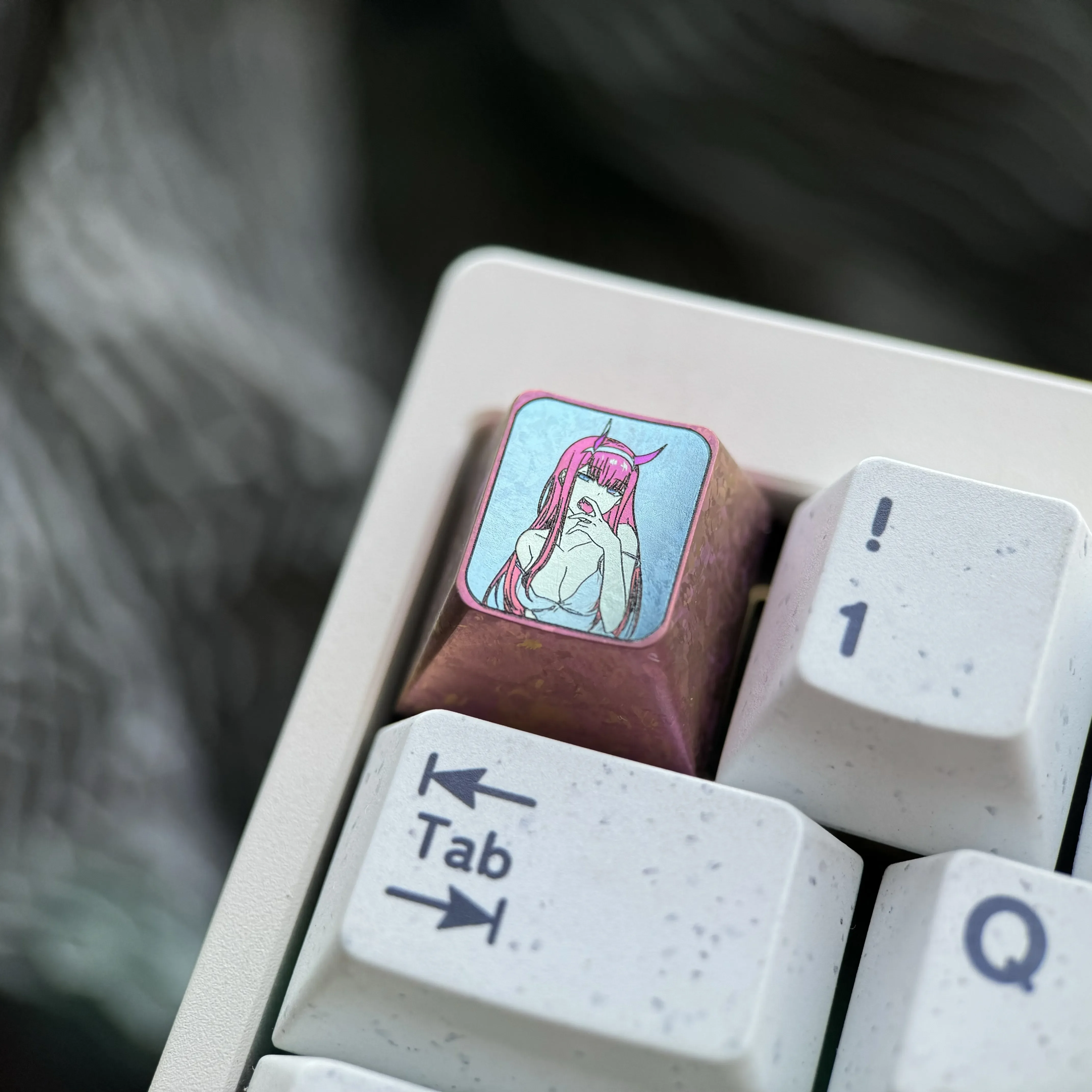 Dynamic shots of the Premium Titanium Zero Two keycap, showcasing its iconic anime details and durable metal from multiple angles for mechanical keyboard.
