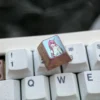 Vibrant collection of premium Titanium Zero Two keycaps from multiple angles, highlighting iconic anime artistry and robust metal craftsmanship for your setup.