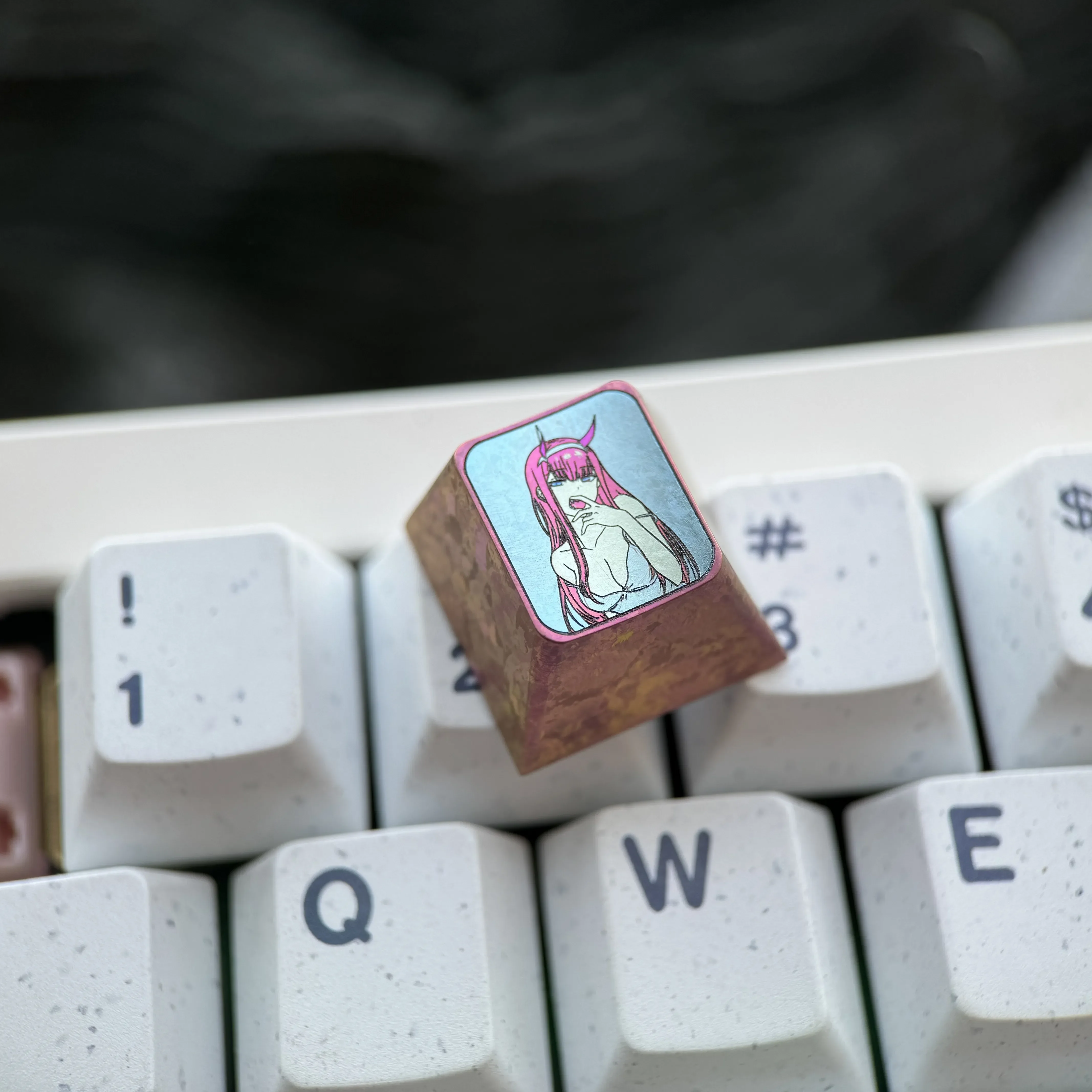 Vibrant collection of premium Titanium Zero Two keycaps from multiple angles, highlighting iconic anime artistry and robust metal craftsmanship for your setup.