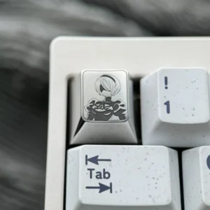 2B Titanium Keycap artisan gallery. Precision-engraved Nier Automata 2B character. Reveals iconic details and premium metallic finish.