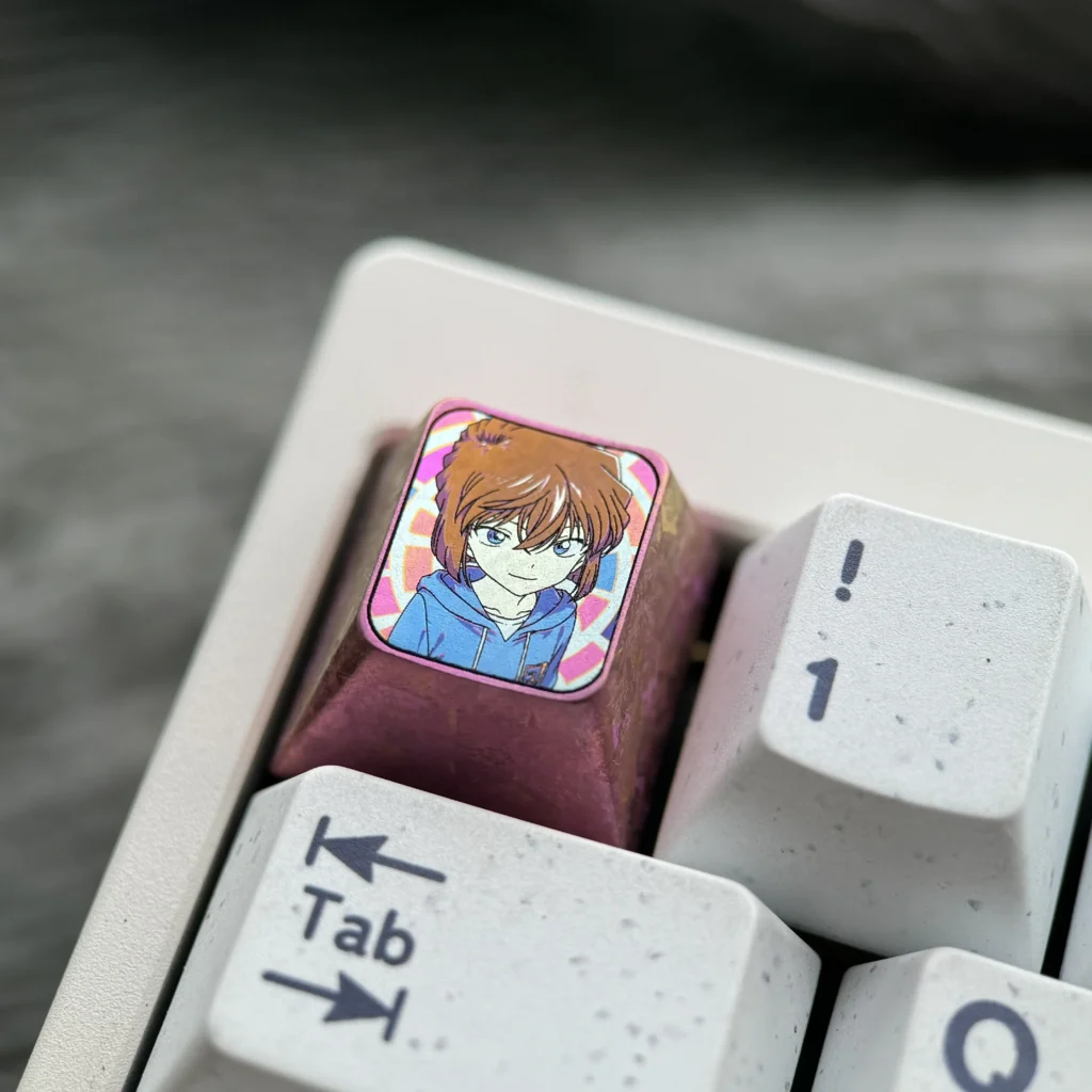 Multiple views of the premium Ai Haibara titanium ESC keycap, highlighting its vibrant anime illustration and exquisite metallic craftsmanship.