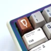 A gallery showcasing various angles of a premium aluminum artisan keycap, featuring playful pop culture food icons with vibrant, handcrafted detail.