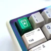 Close-up views of playful pop culture food icon aluminum artisan keycaps, showcasing premium handcrafted detail and vibrant colors from various angles.