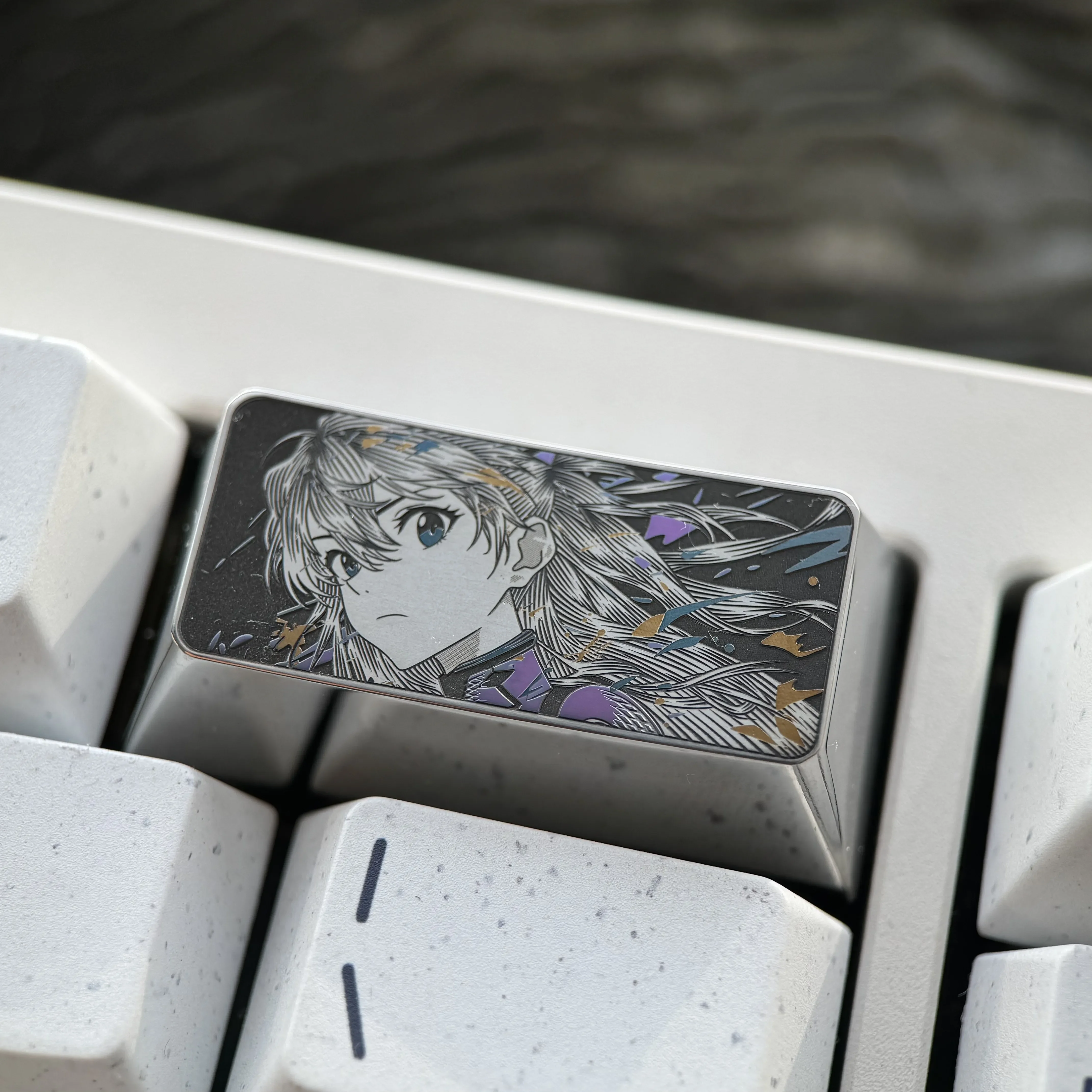 Detailed view of the premium alloy Asuka keycap, showcasing iconic Evangelion Asuka Langley Soryu with precision engraving on its metallic surface.
