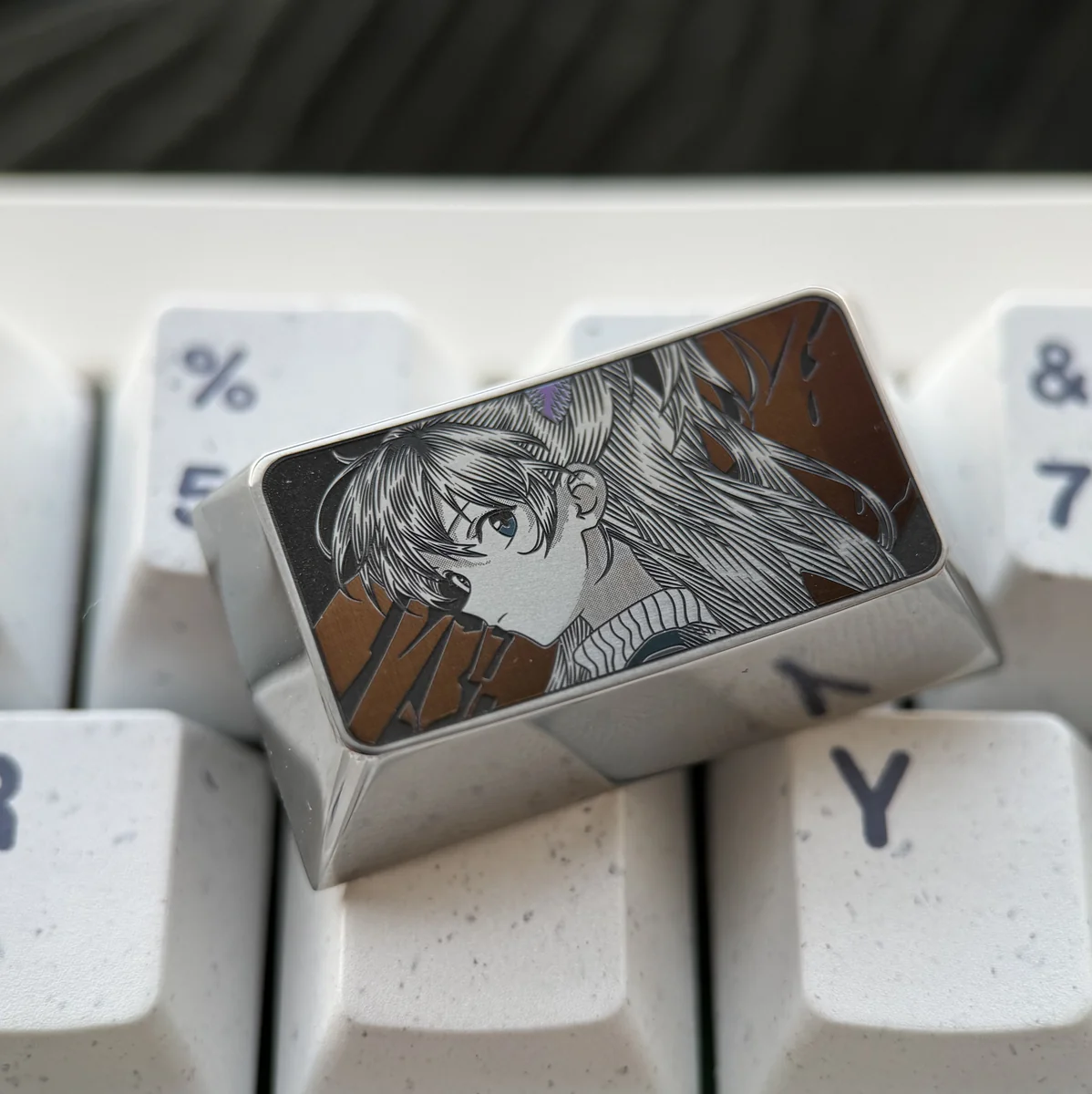 Asuka Keycap, precision-engraved Evangelion artisan tribute. Multiple views show intricate metallic detail and futuristic mech design.