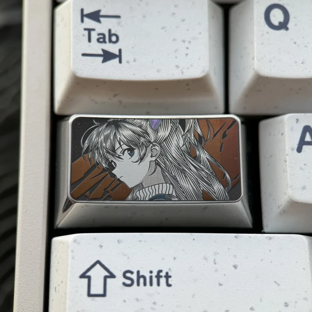 Asuka Keycap featuring precision-engraved Evangelion anime art, showcasing intricate metallic detail and a futuristic mech design.