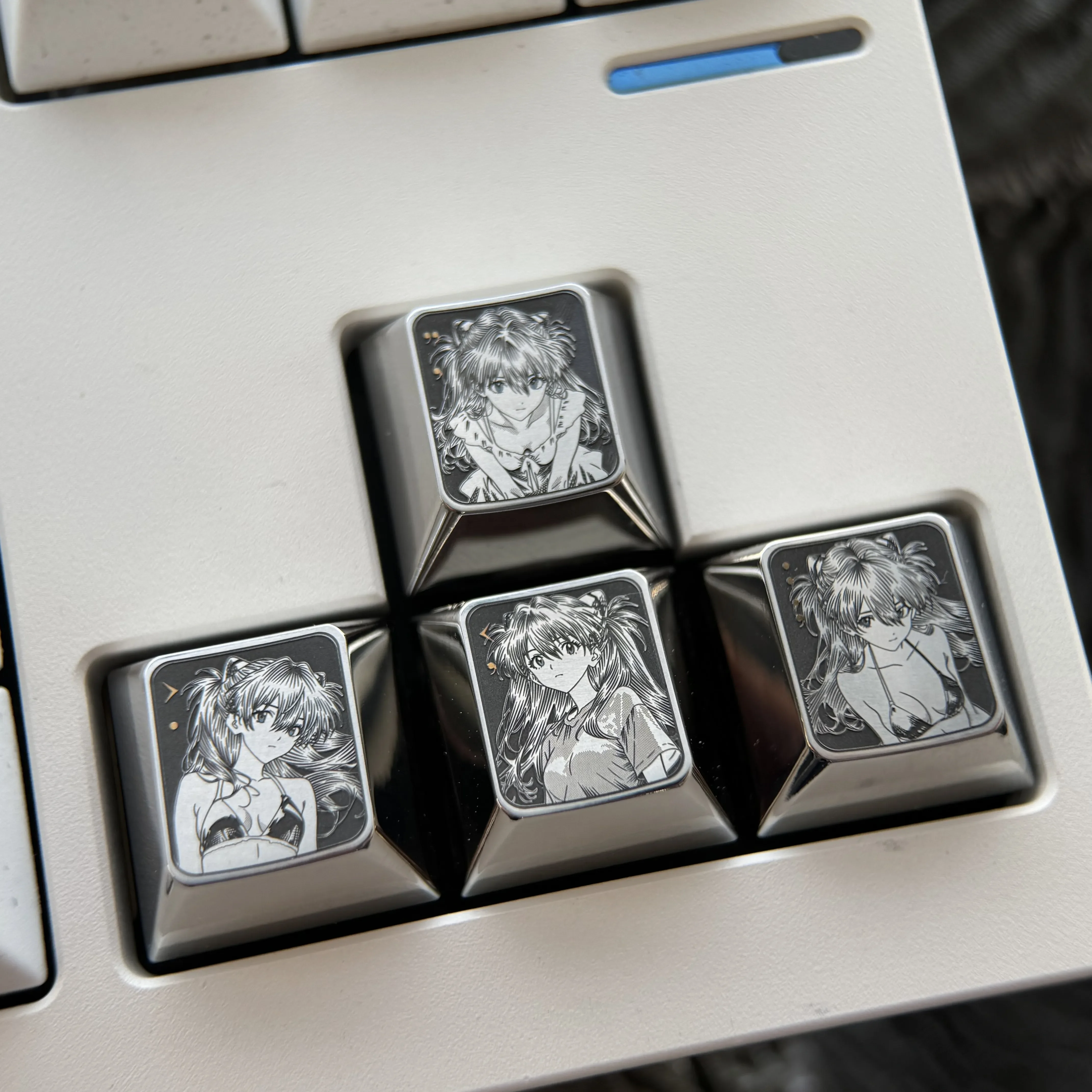 Precision-engraved Asuka titanium alloy keycaps for Evangelion fans, showcasing vibrant anime art with a stunning metallic sheen.