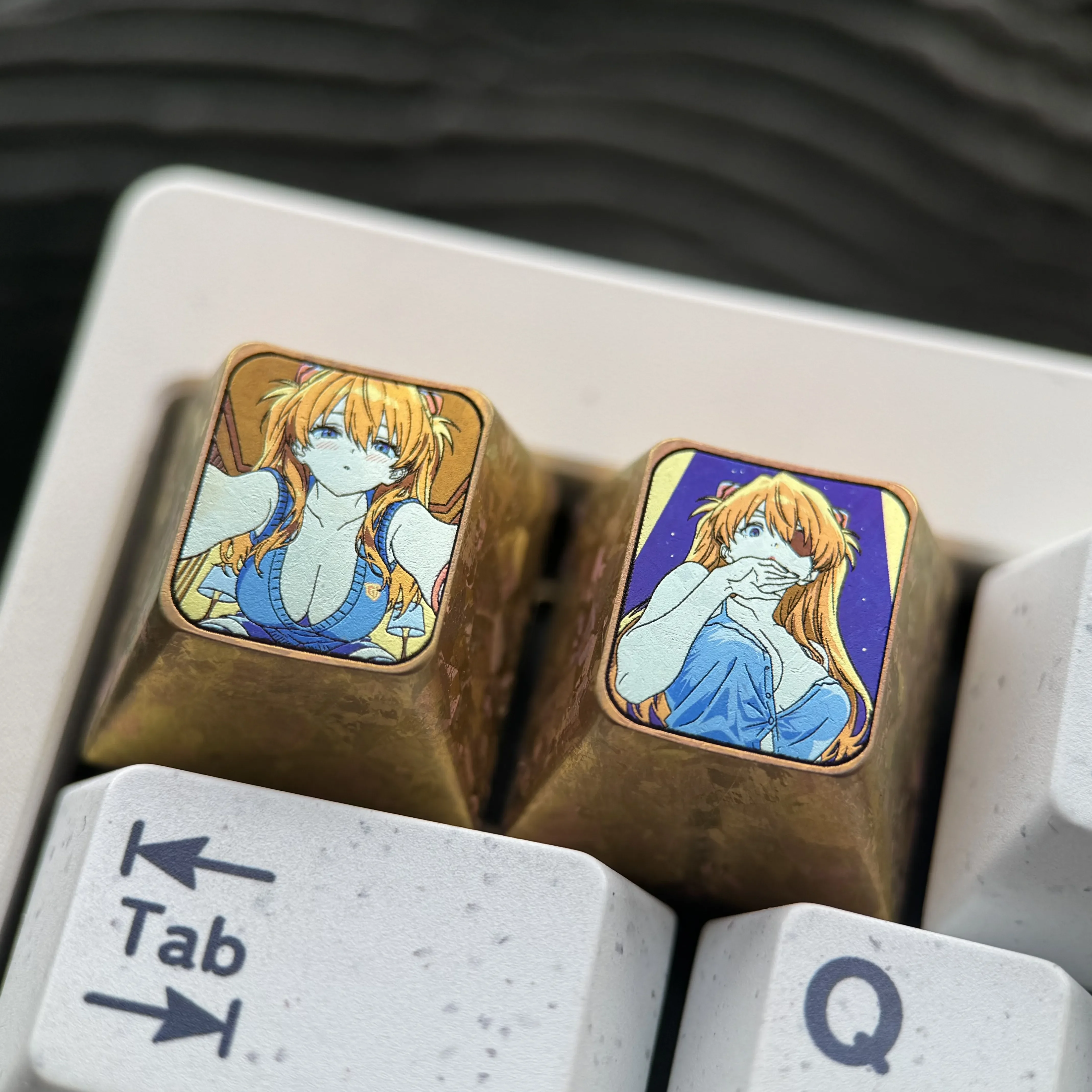 The premium Asuka Evangelion Titanium ESC keycap from various angles, emphasizing its vibrant anime tribute, striking colors, and precision metalwork.