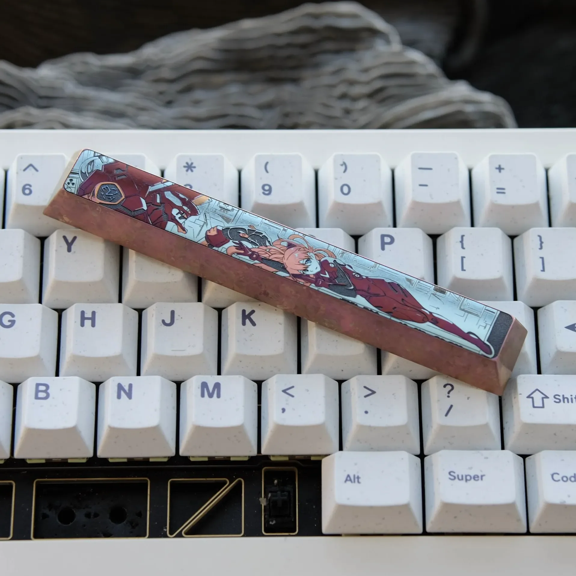 Premium handcrafted Asuka Titanium Keycap artisan space key, showcasing its striking deep red Evangelion mecha artistry.