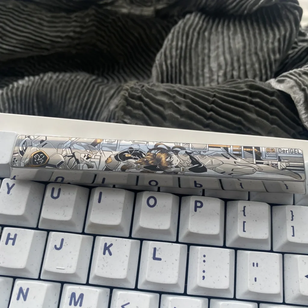 Close-up of a premium Asuka Titanium Keycap, showcasing the precision-engraved iconic anime mecha design on a durable titanium spacebar.
