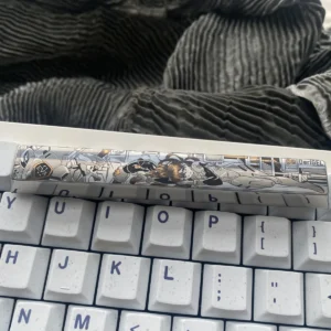 Close-up of a premium Asuka Titanium Keycap, showcasing the precision-engraved iconic anime mecha design on a durable titanium spacebar.