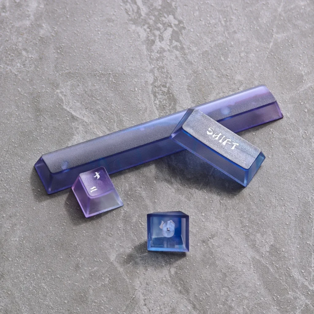 Aurora Keycaps set displayed from various angles, highlighting their ethereal frosted translucent design and vibrant light-diffusing capabilities.