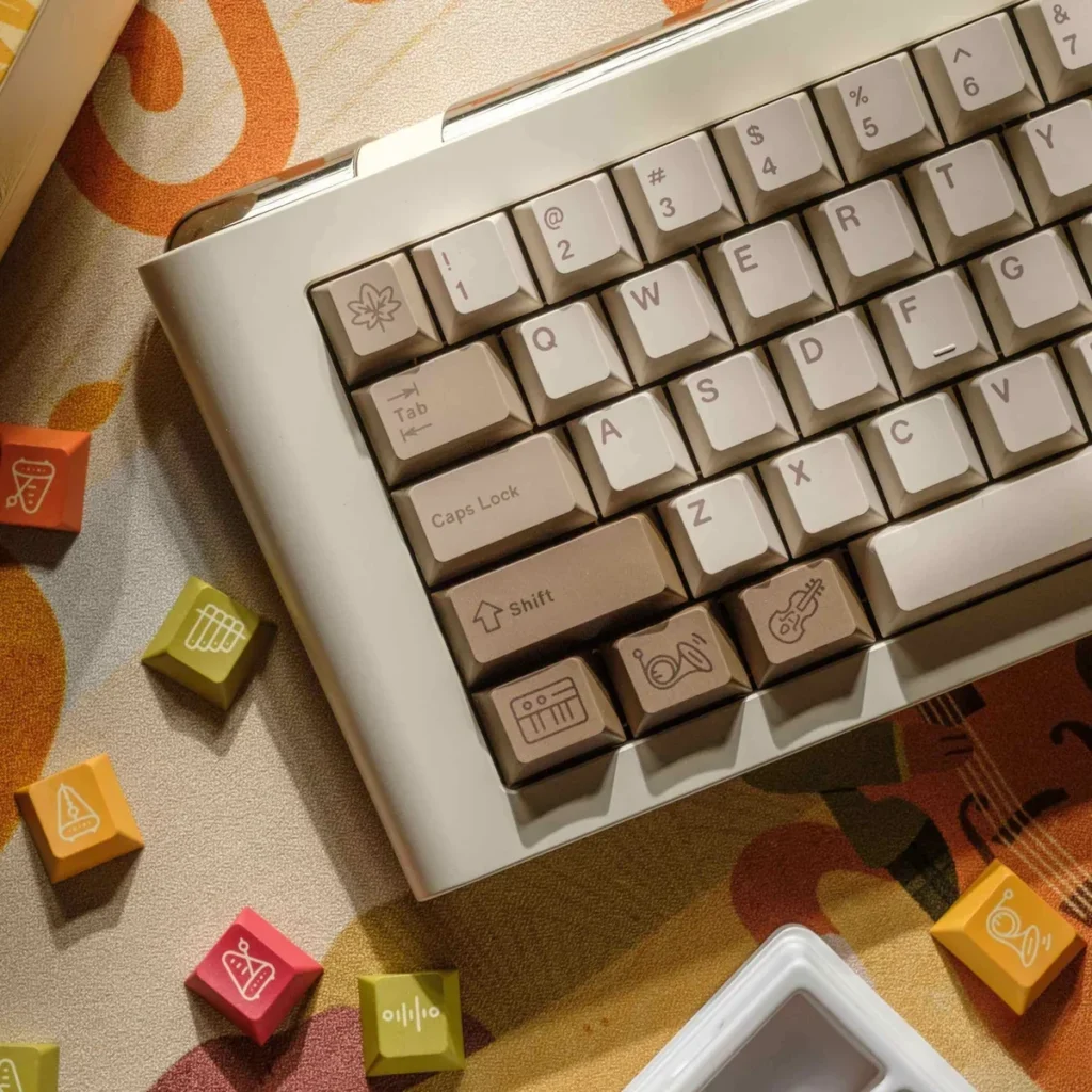 Autumn Concert Dye-sub PBT keycaps set, highlighting vintage instruments and serene autumn forest imagery in warm, earthy tones.