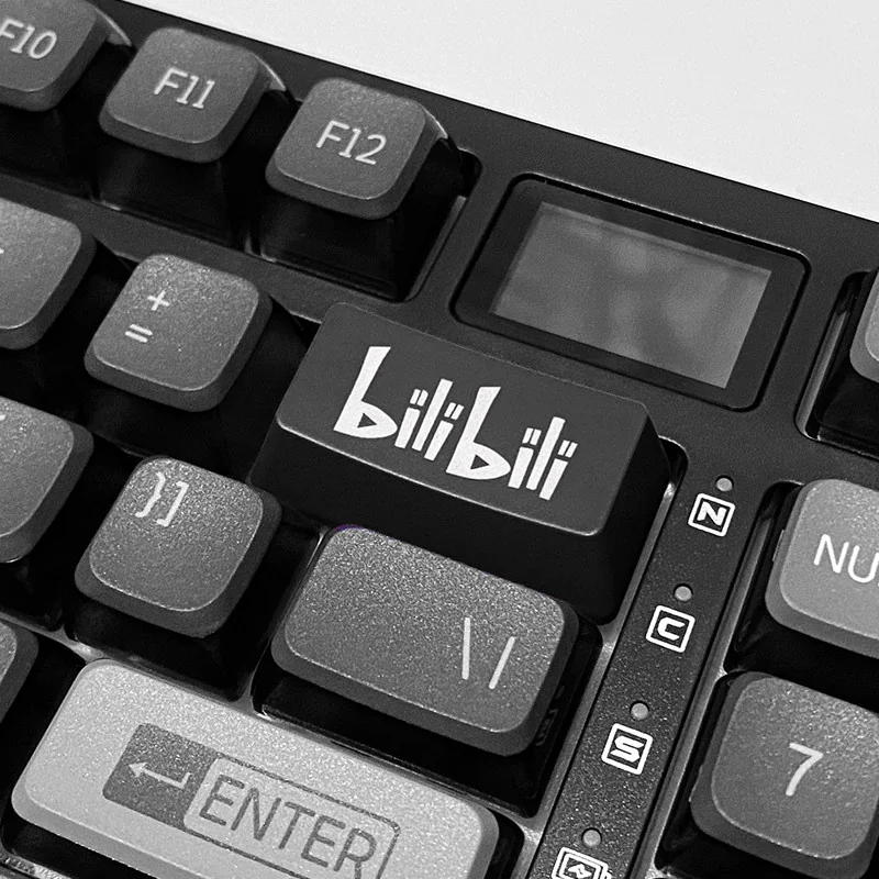 A sleek black BiliBili backspace keycap, featuring iconic branding and RGB-ready design for vibrant desktop accents.