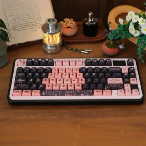 Multiple angles showcasing the exclusive Black Pink PBT dye-sub keycaps set, featuring bold black and pink designs on unique profile mechanical keyboard.