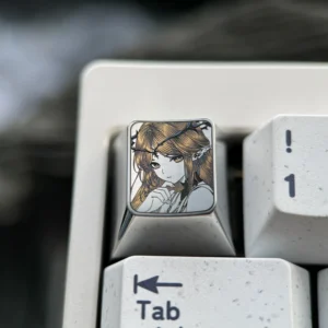 Cartethyia precision-engraved titanium anime ESC keycap, showcasing intricate pointillism character art on its polished surface.