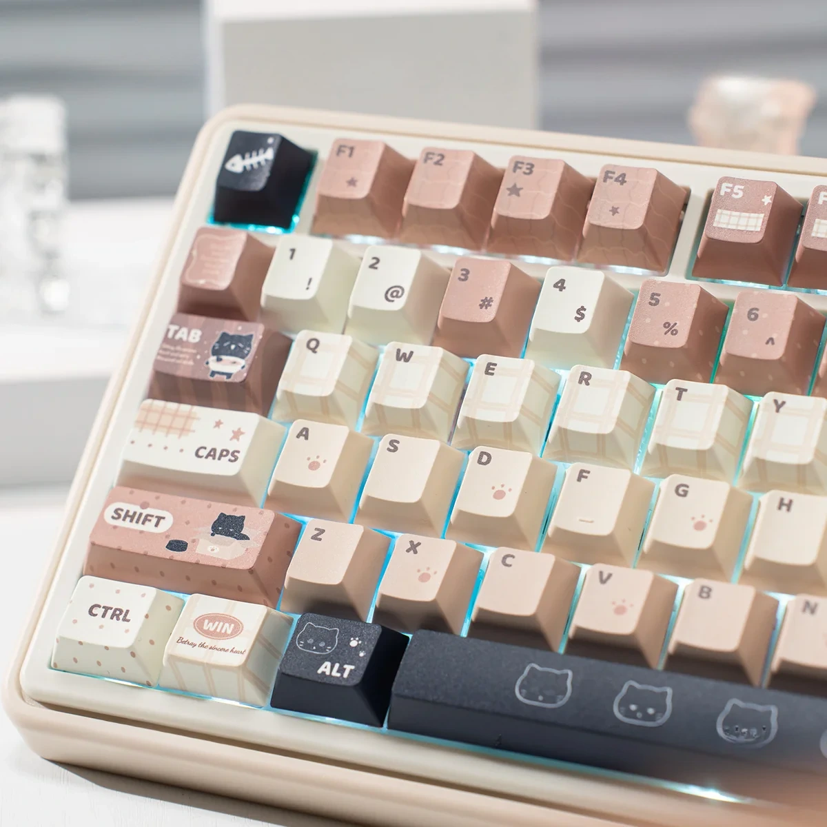 A gallery of whimsical cat keycaps set, showing durable PBT dye-sublimated designs from multiple angles in a cozy coffee and cream palette.