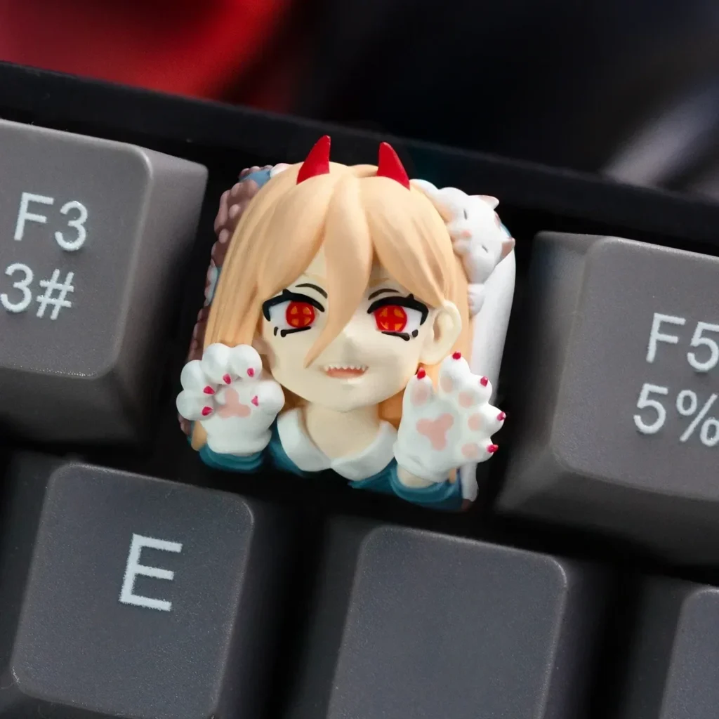 Handcrafted resin Chainsaw Man Power keycap for mechanical keyboards, showcasing a dynamic and cute anime character with vibrant colors.