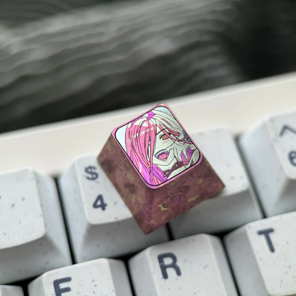 Premium Chainsaw Man Power titanium keycap gallery, highlighting its vibrant anime design and meticulous colored titanium artistry from all angles.