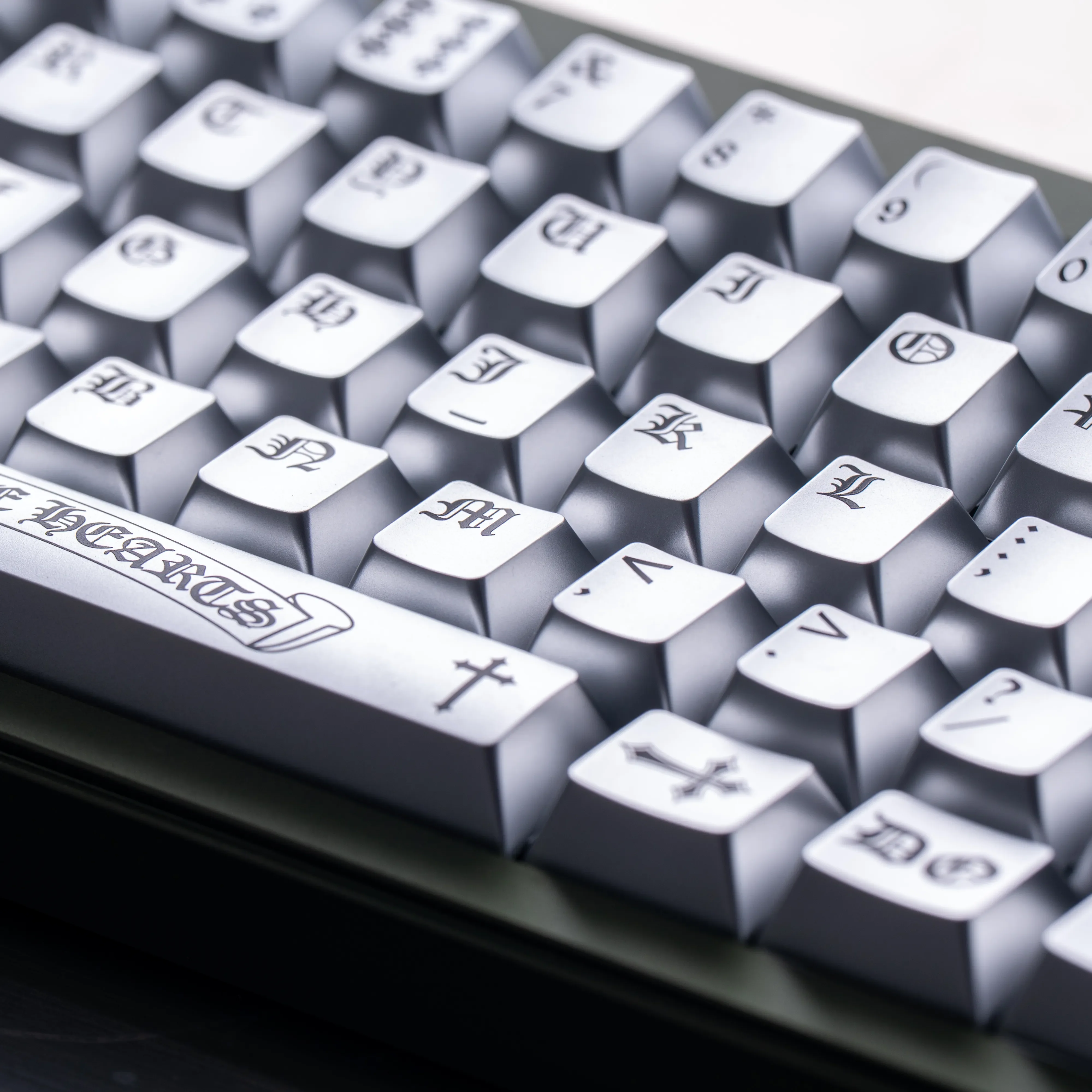 Multiple views of the Chrome Hearts Keycap Set, Chrome Hearts style. Highlights its dark, distressed finish and magnetic switch.