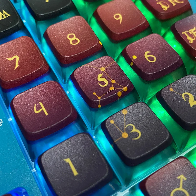 A vibrant set of Cosmic Constellation Pudding PBT Keycaps Set, ASA profile, featuring anime-inspired celestial designs and translucent sides for vivid RGB.